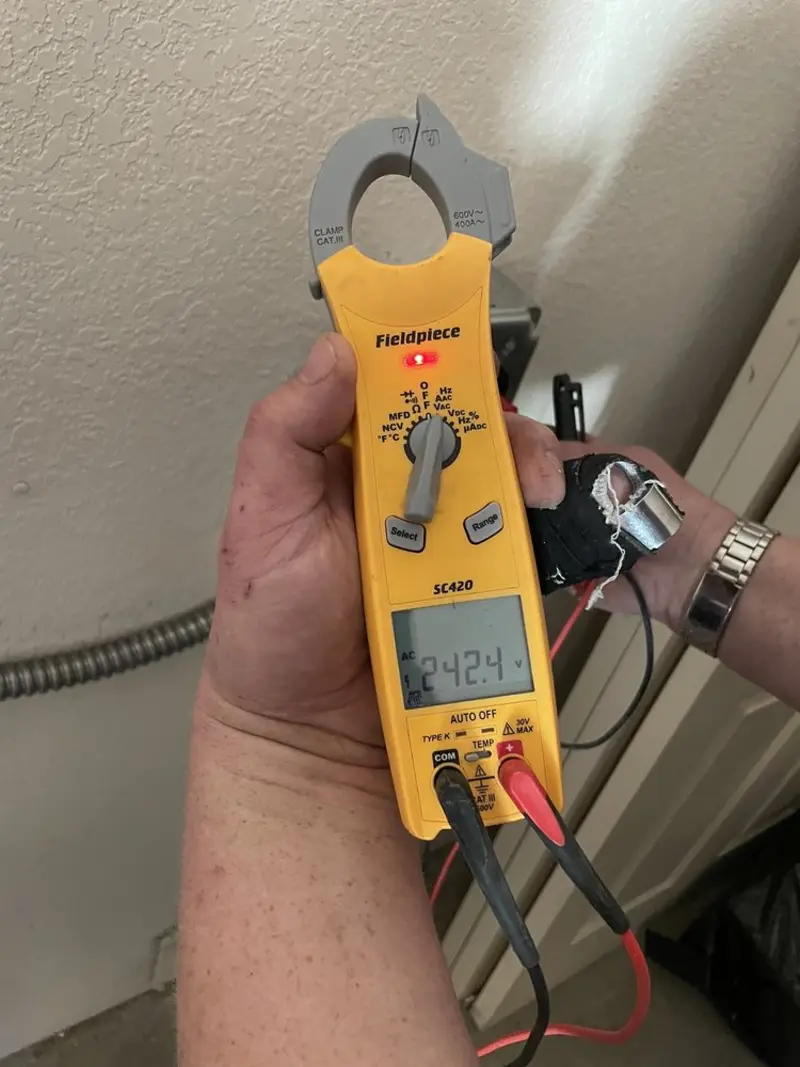Voltage testing with clamp meter during Generator Installation in Barnstable Town